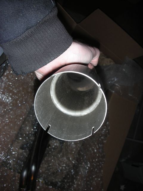 2004 Ford Crown Victoria - A close-up view of a stainless steel exhaust pipe, likely part of an aftermarket exhaust system.