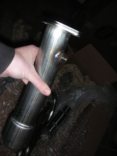 2004 Ford Crown Victoria - Close-up of a stainless steel exhaust component, possibly a header or pipe section.