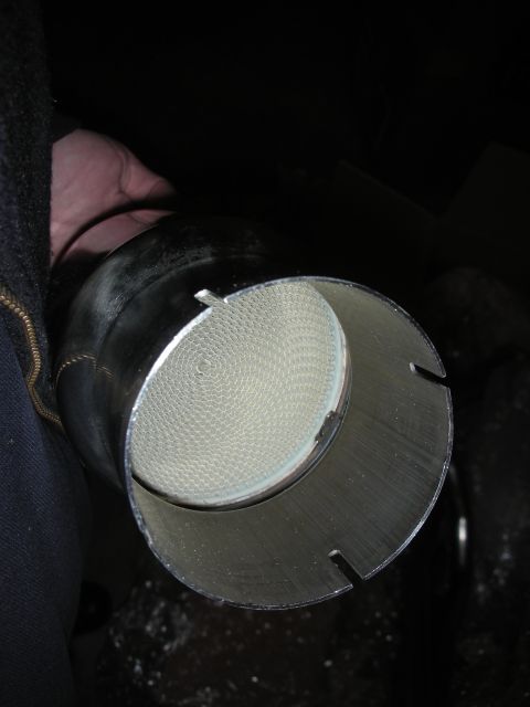2004 Ford Crown Victoria - A close-up view of the honeycomb structure inside a catalytic converter.