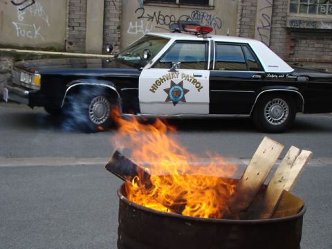1991 Ford LTD Crown Victoria - A black-and-white Ford LTD Crown Victoria marked 'HIGHWAY PATROL' with a CHP-style star door decal and 'Safety and Service' rear quarter le…