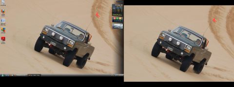 1982 Ford Bronco - A dark green Ford Bronco is shown driving on a sandy terrain, kicking up dust.