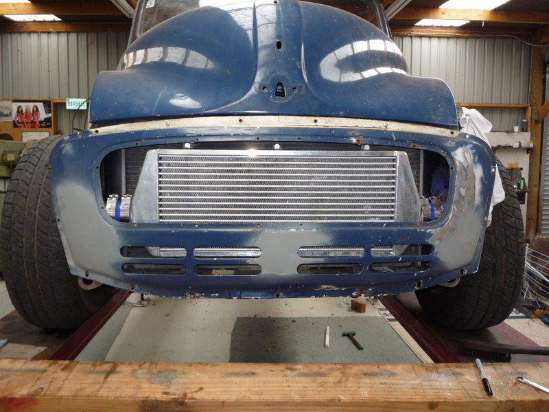 Front view of blue Mini Cooper project with large intercooler and wide tires