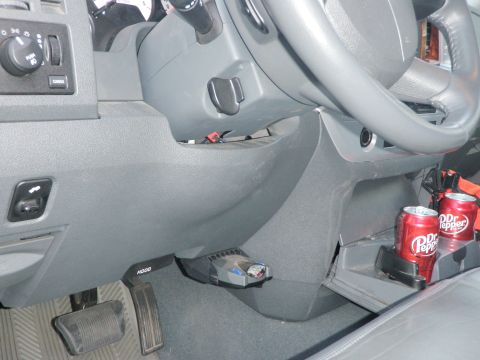 2007 Dodge 2500 - Interior view of a vehicle's dashboard, showing a brake controller and two cans of Dr. Pepper.