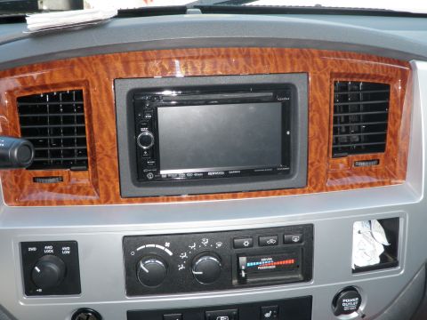 2007 Dodge 2500 - Dashboard interior with aftermarket stereo and climate controls visible.