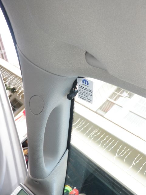 2007 Dodge 2500 - A Mopar tag is attached to the interior pillar of a vehicle, with text visible.