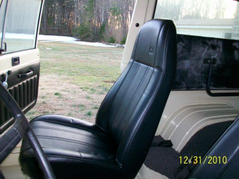1986 Jeep Wagoneer - Interior view of a 1986 Jeep Wagoneer, highlighting the seats and door panel.