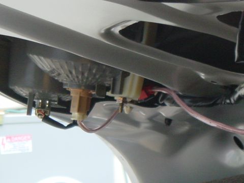 2003 Mazda 6 - Wiring and bulb socket detail of a car's tail light assembly.