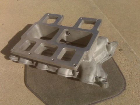 1972 Ford Ranchero - This is an aluminum dual port intake manifold shown from an angle on a mat.