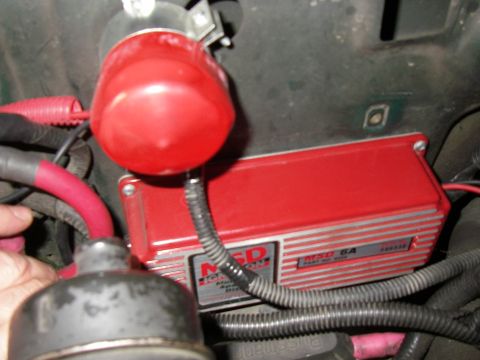 1990 Ford Bronco - The MSD 6A ignition box and a red ignition coil are visible in this engine bay detail shot.