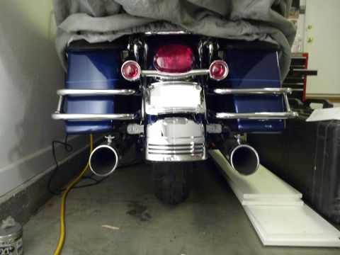 2007 Harley-Davidson Electra Glide Clsc - Motorcycle rear view showing saddlebags, chrome accents, and exhaust pipes.