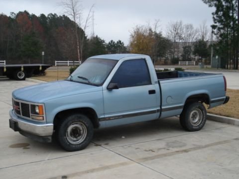 1979 Chevrolet C/K Pickup - This GMC pickup truck appears to be from the mid-1990s, not a 1979 Chevrolet C/K.