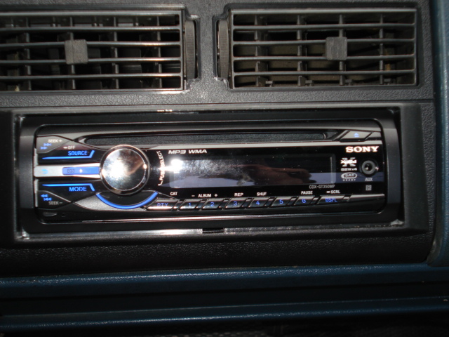 Sony car stereo with MP3 WMA display and buttons, above air vents