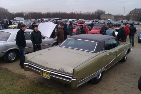 1991 Ford LTD Crown Victoria - A gold 1969 Buick Electra 225 is parked at an outdoor car show.