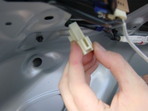 2003 Mazda 6 - Disconnecting an electrical connector from a wiring harness.