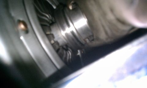 1990 Ford Mustang - Close-up view of a metallic component with visible wiring and a bolt.