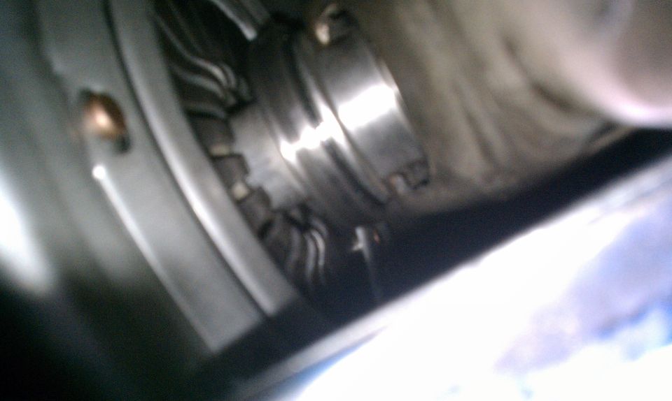 close-up of a metal component with wires and a bolt