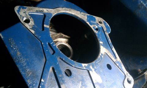 1990 Ford Mustang - A close-up view of a blue metal automotive part with visible part numbers and signs of wear.