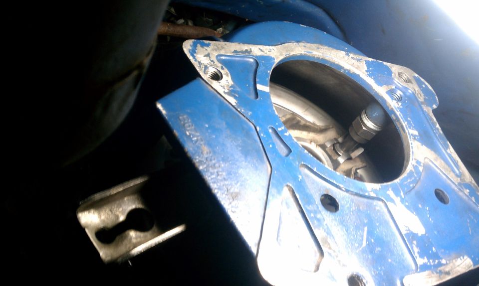 Blue metal part with visible text and bolts