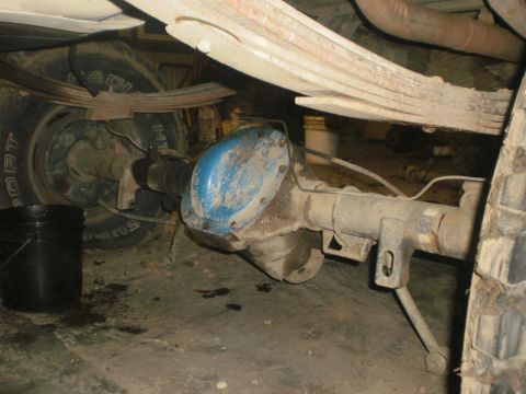 1995 Ford Bronco - Underneath view of a vehicle's rear axle assembly, showing leaf springs and a differential.