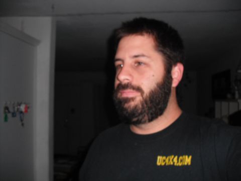 1991 Ford Bronco - A man with a beard is shown in a dark room, wearing a t-shirt with a website address.