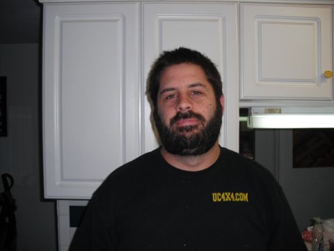 1991 Ford Bronco - Man with beard wearing a black t-shirt with UC4X4.COM text in yellow.