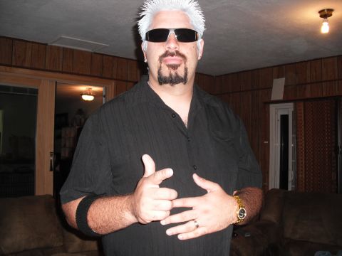 1991 Ford Bronco - A person dressed as Guy Fieri poses for a photo, complete with signature hairstyle and goatee.