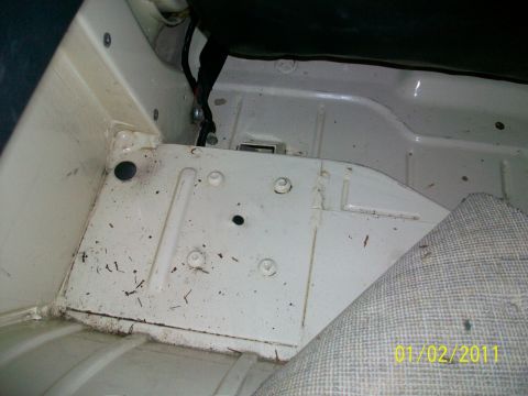 1986 Jeep Wagoneer - The interior of the vehicle shows some wear and tear on the metal floor panels.