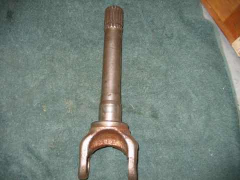 1992 Ford Bronco - A close-up view of a metal driveshaft U-joint yoke, likely a replacement part.