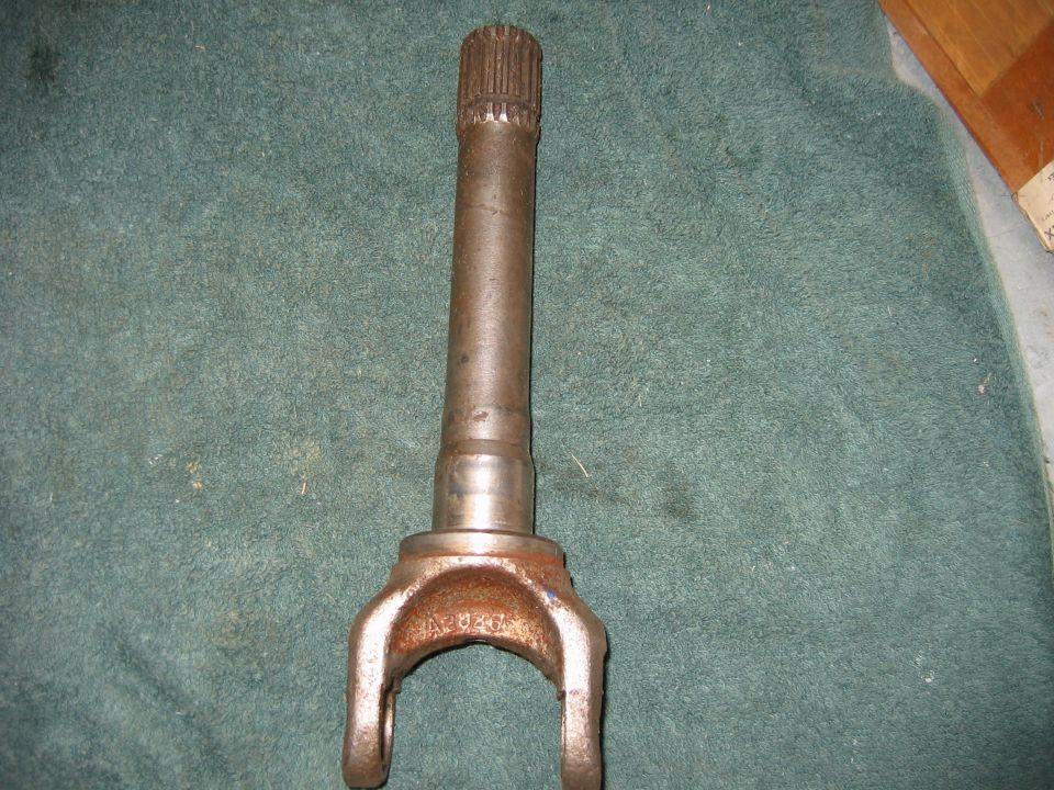 Driveshaft U-joint yoke with splines on one end and a yoke on the other