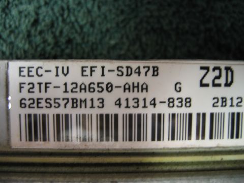 1992 Ford Bronco - Close-up of an engine control module label showing part numbers and codes.