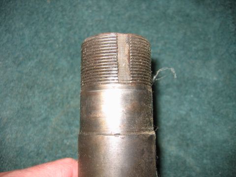 1992 Ford Bronco - This is a close-up of a metal shaft with a knurled end and a machined slot.