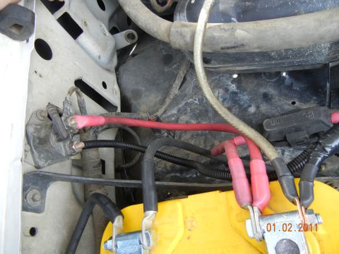 1996 Ford Bronco - Close-up view of a car battery and its wiring, with a timestamp indicating the photo was taken on January 2, 2011.