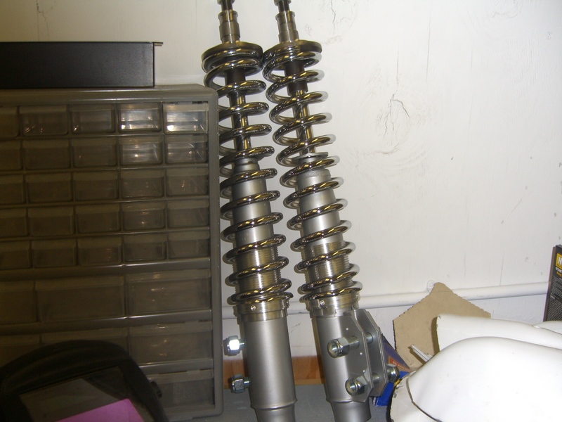 Pair of chrome motorcycle shock absorbers with silver springs