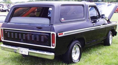1979 Ford Bronco - Rear view of a black 1978 Ford Bronco with its hood open, parked outdoors.