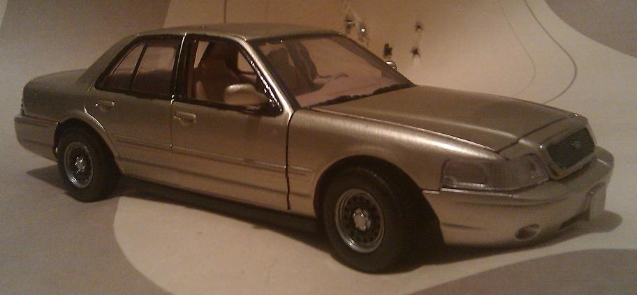 Model of a 2000 Mercury Grand Marquis, gold paint, tan interior