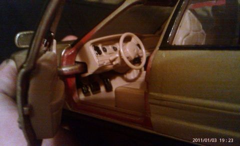 2000 Mercury Grand Marquis - Close-up view of a model car's interior, showing the dashboard and seating area.