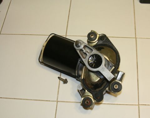 1976 Ford Ranchero - A windshield wiper motor assembly is shown on a tiled surface.