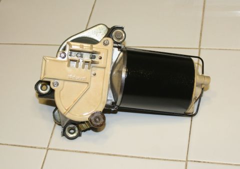 1976 Ford Ranchero - A close-up view of a windshield wiper motor assembly, showing its mechanical components and housing.