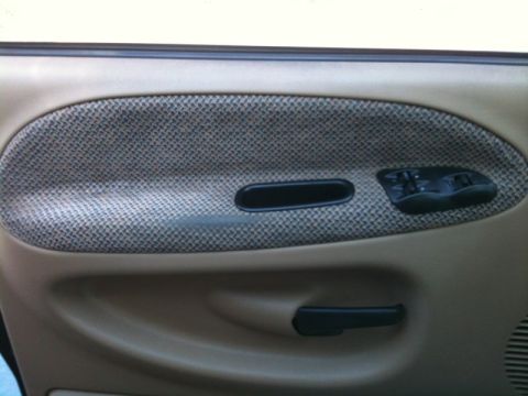 1966 Ford Bronco - The interior door panel features fabric upholstery and power window controls.