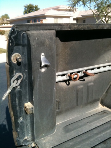 1966 Ford Bronco - Truck bed interior with a bottle opener and tie-down rings visible.