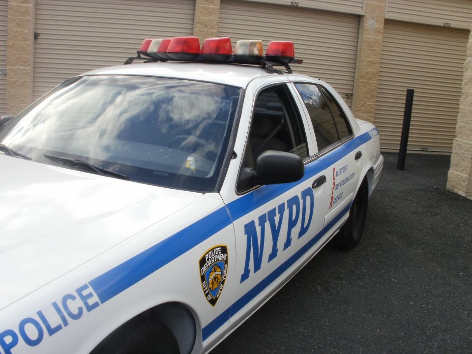 NYPD police car, front quarter view. Shows "POLICE" and "NYPD" markings
