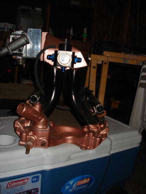 1988 Ford Bronco - Custom engine intake manifold assembly with fuel rails and regulator, placed on a cooler.