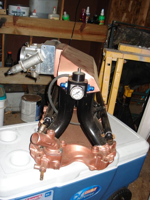 1988 Ford Bronco - This engine part is shown on a cooler in a workshop setting.