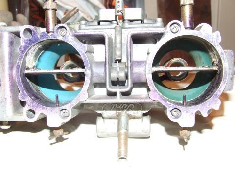 1973 Ford Mustang - A Ford carburetor is shown with visible markings and internal coloration.