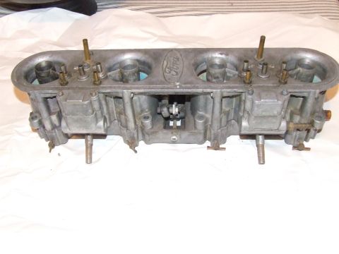 1973 Ford Mustang - Ford dual carburetor intake manifold with "Ford" logo visible on top.