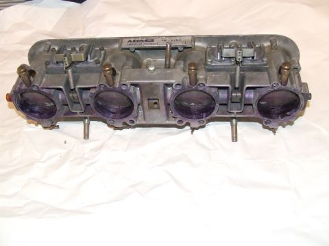 1973 Ford Mustang - A close-up view of an Autolite 4100 carburetor, a component for a vehicle.