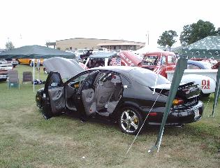 1997 Ford Taurus - 1997 Ford Taurus on display with all doors and hood open.
