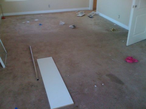 1968 Ford Mustang - This image depicts an interior scene of a room that appears to be under construction or renovation, with debris scattered across the carpet…
