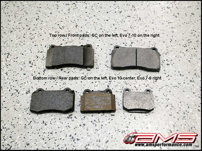 Four brake pads laid out on a speckled surface, labeled as front and rear pads for GC and Evo models