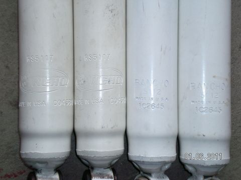 1996 Ford Bronco - Close-up view of four Rancho shock absorbers, showing part numbers and 'Made in USA' markings.